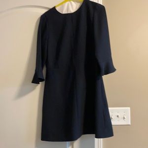 Navy dress barely worn. Dry cleaned.